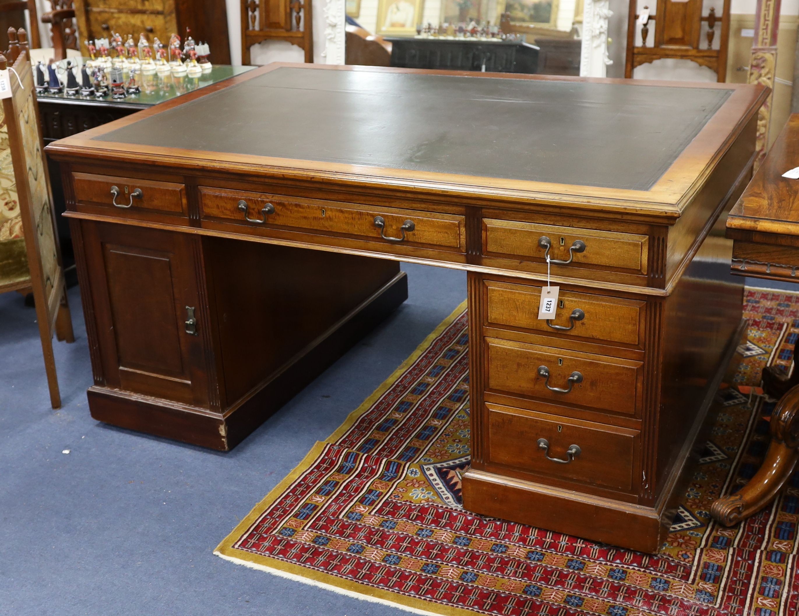 A Victorian mahogany pedestal partner's desk by Maple & Co., length 152cm, depth 105cm, height 78cm